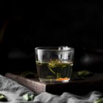 arrangement-with-drink-with-herbs-dark-background